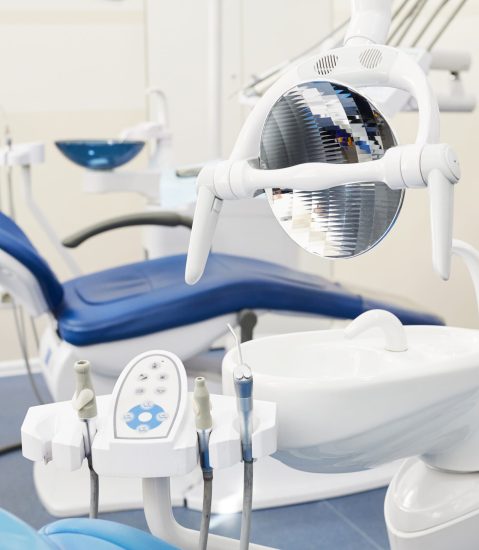 Background image of dental chair and equipment in empty dentists office, copy space